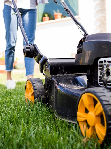 woman mowing yard close up 23 2148579933 1